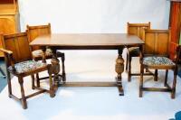 An oak refectory style dining table and a set of six chairs.