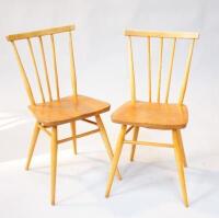 A pair of Ercol dining chairs.