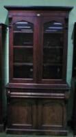 A Victorian flamed mahogany cabinet bookcase