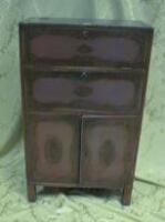 A red lacquer side cabinet with lid top