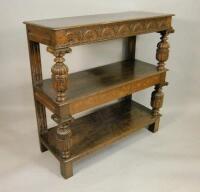 A carved oak three tier buffet in 17thC style