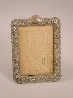 An early 20thC pierced silver photograph frame