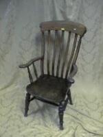 A Victorian ash and elm grandfather chair with turned legs