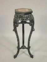 A carved Chinese hardwood urn stand