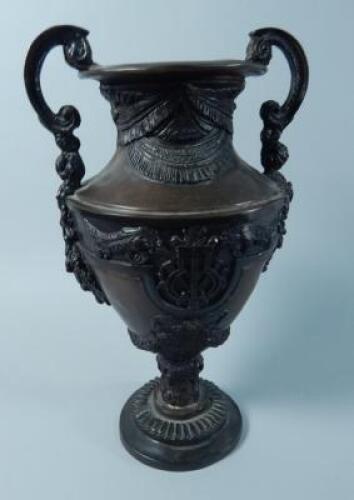 A reproduction bronze two handled urn