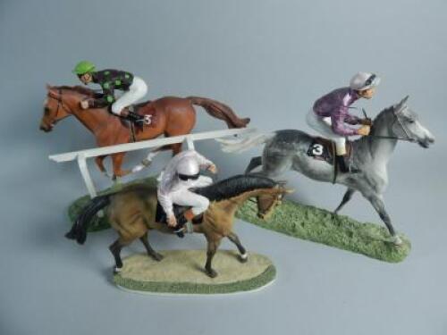 Three composition race horses and jockeys