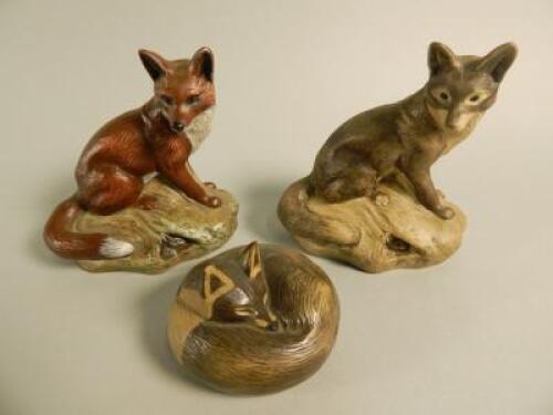 Three Poole Pottery fox ornaments