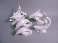 Five Poole Pottery white dolphin ornaments