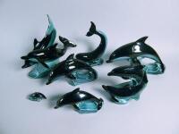 Seven Poole Pottery black and blue dolphin ornaments