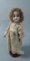 A Schutzmeister & Quendt bisque headed doll