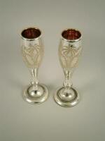 A pair of Victorian silvered glass vases