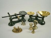 Two similar sets of cast iron and brass scales