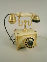 An onyx and gilt brass telephone.