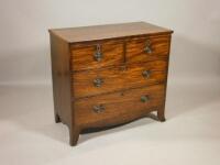 An early 19thC mahogany chest of two short and two long drawers