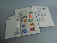 Two albums of stamps.