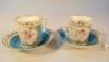 A pair of 19thC Sevres Louis Philippe crest coffee cans and saucers