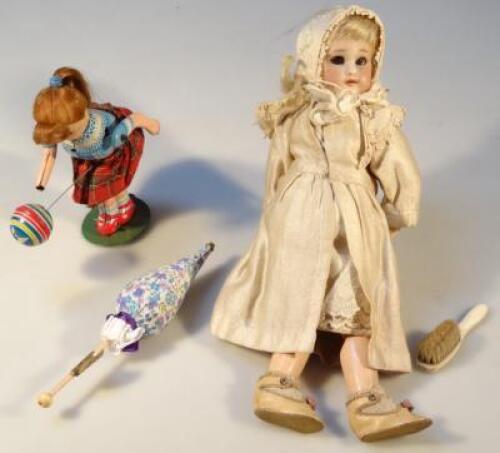 A late 19thC bisque headed doll