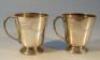 A pair of silver christening mugs