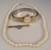 A strand of freshwater pearls attached to a 9ct mount