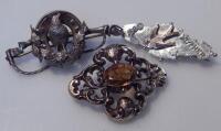 Three decorative silver brooches