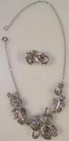 A costume jewellery set comprising necklace and earrings.