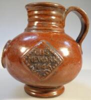 An unusual King Charles commemorative earthenware bottle flask