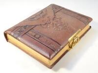 *An Edwardian pressed leather photograph album