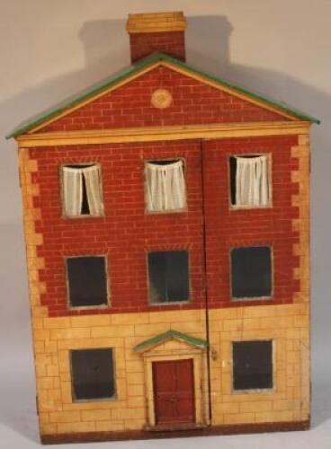 A large freestanding child's dolls house