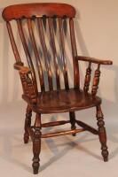 A 19thC ash and elm spindle back grandfather chair