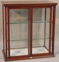 An early 20thC mahogany table top confectionery cabinet by Hawkes Ltd.
