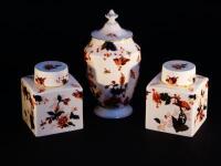 A pair of Coalport square jars and covers