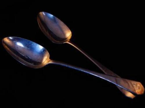 A pair of George III silver serving spoons