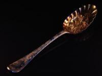 A Georgian silver berry spoon