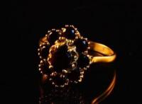A Victorian style garnet cluster ring