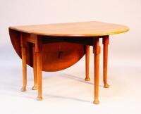 A Victorian oak dropleaf table.