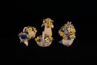 Six Royal Doulton posy ornaments.