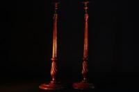 A pair of late 19th/early 20thC oak and brass candlesticks