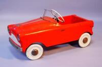 A child's pedal car