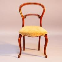 A Victorian walnut bar back salon chair