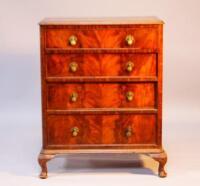 An early 20thC flamed mahogany finished chest of four long drawers