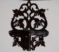 A heavily carved oak Black Forest style wall sconce