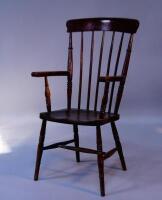 An early 20thC stick back grandfather chair.