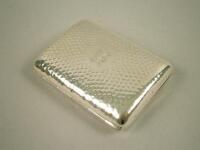 A rectangular silver cigarette case