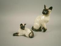 Two Beswick Siamese cats