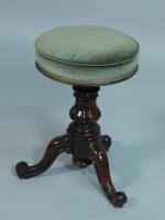 A Victorian adjustable rosewood revolving piano stool