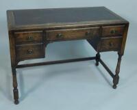 An oak writing table in Art Deco style