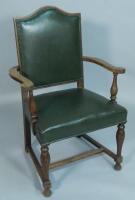 An early 20thC oak open armchair