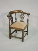 An early 19thC oak and elm corner chair