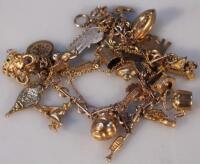 A 9ct and other yellow metal charm bracelet