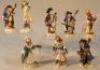 A quantity of Sitzendorf monkey band figures